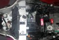L'ecu se situe dans la cage métallique avec vis a tête autocassante